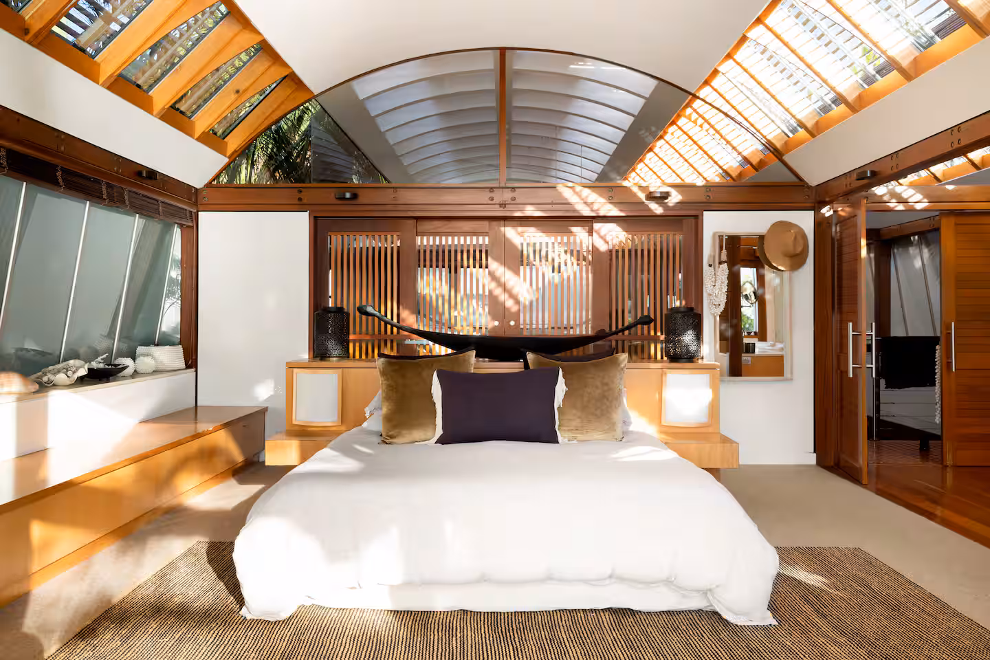 Primary king suite with vaulted ceiling and skylight